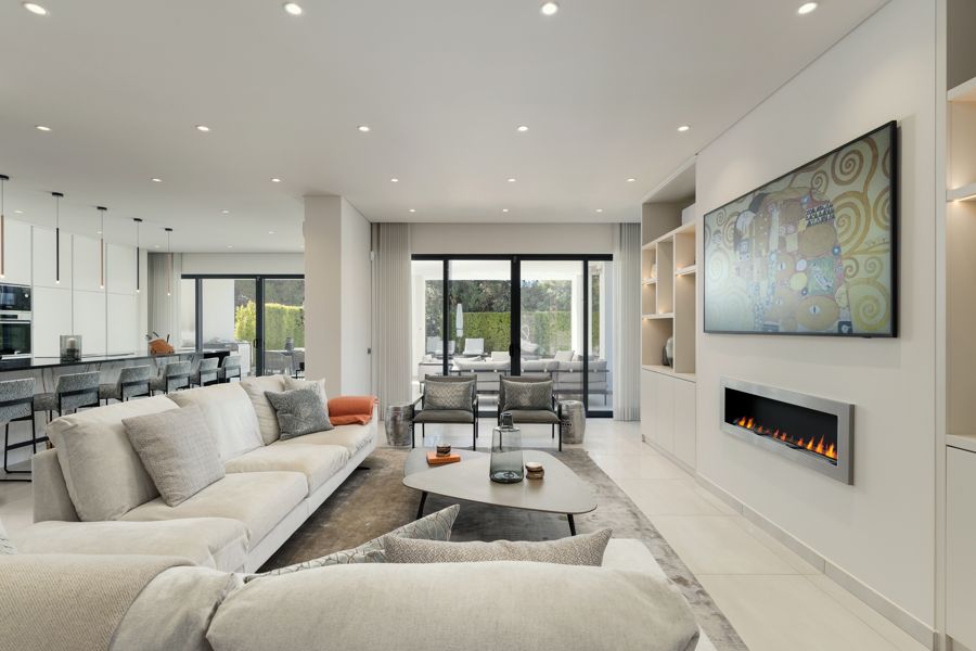 Living room with pale sofas, fireplace and artwork — Encosta do Lobo, Vale do Lobo