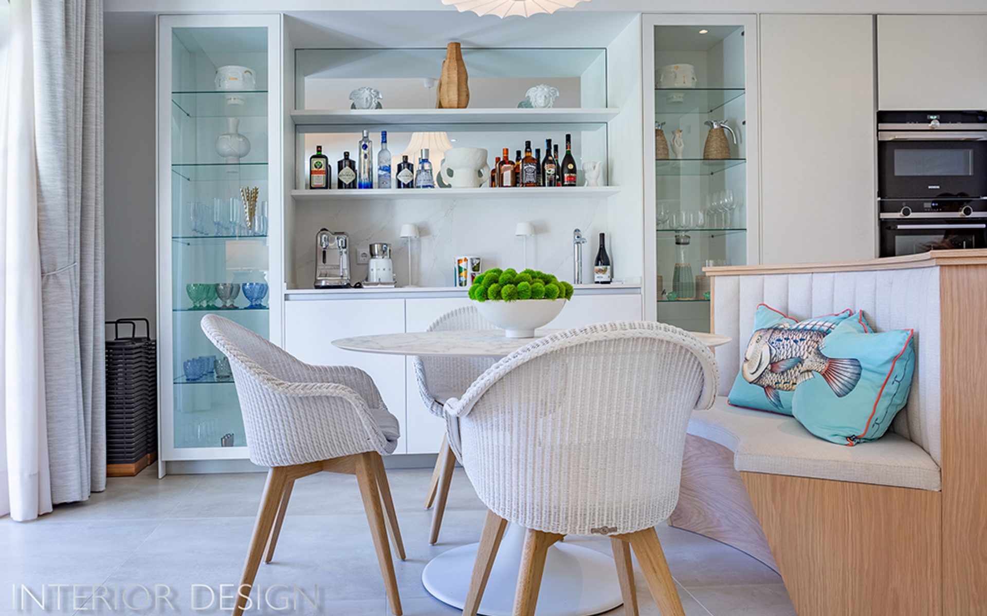 Dining area with pale chairs and blue artwork — Vale dos Pinheiros, Quinta do Lago