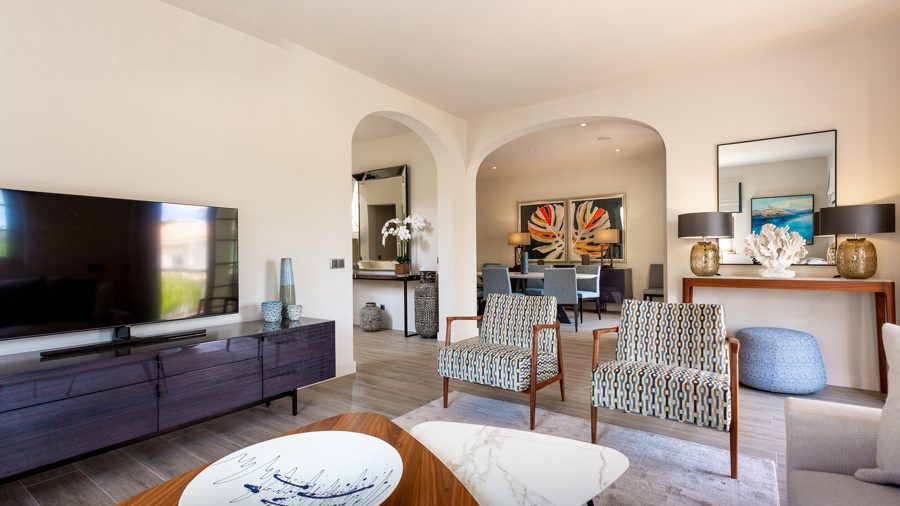 Living room with television and patterned armchairs — Residências do Lago, Quinta do Lago
